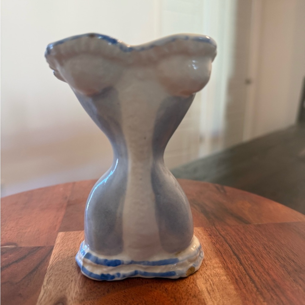 A vintage Brayton Laguna Pottery corset-shaped ceramic vase.